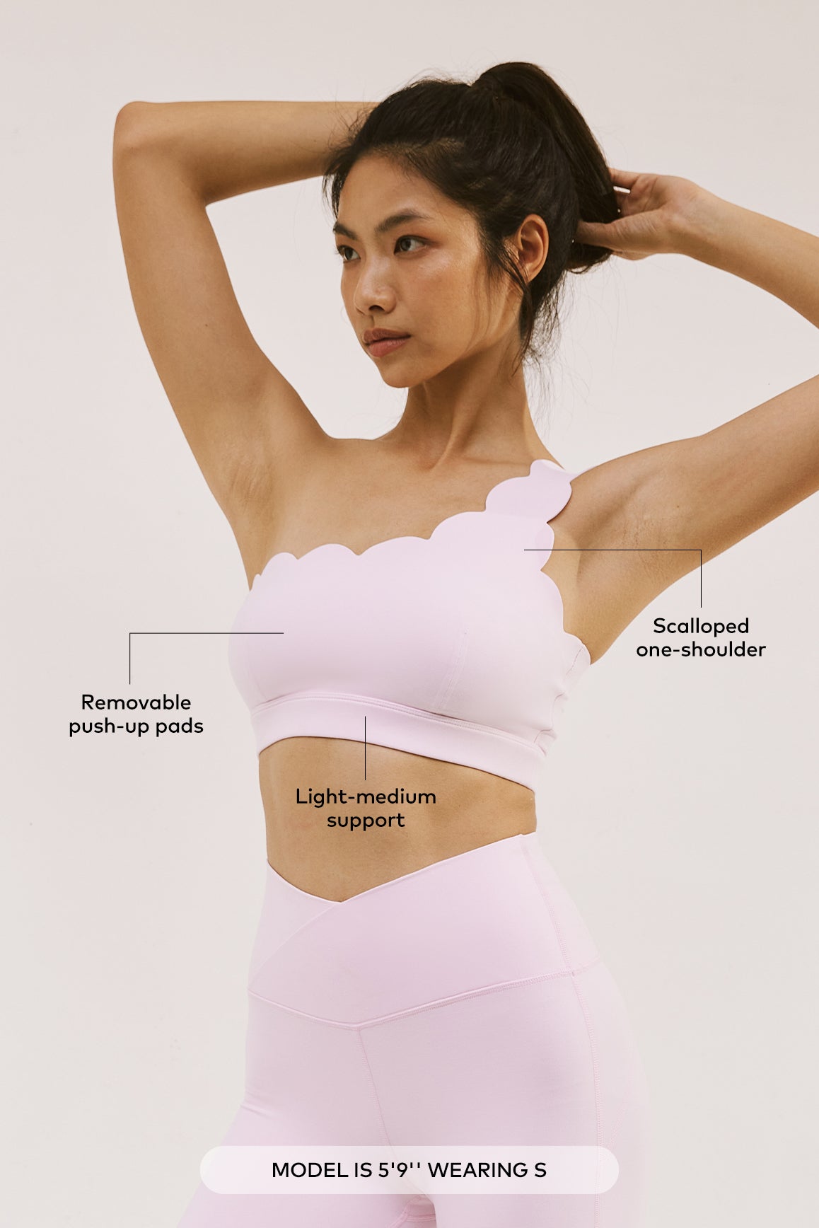 WISKII women's dynamic one-shoulder sports bra in black, featuring a stylish and supportive design for active wear.