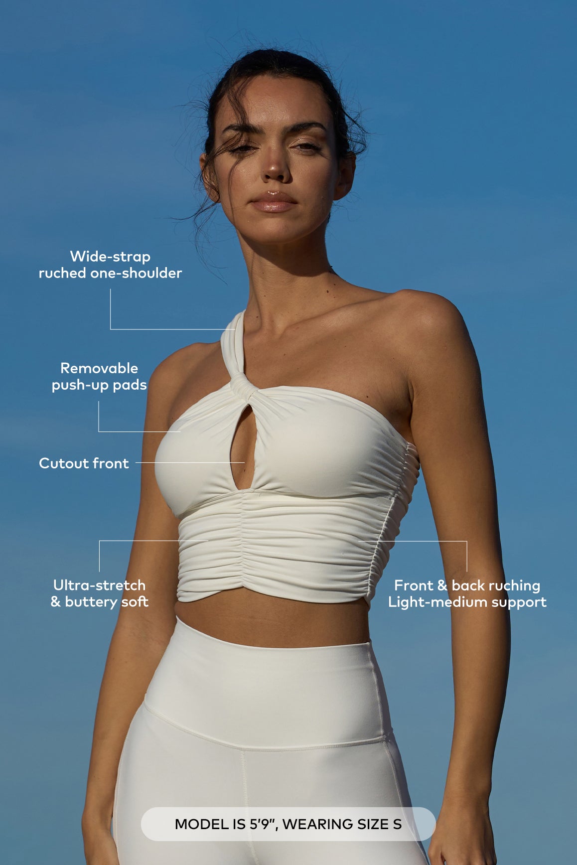 WISKII one shoulder ruched sports bra in black, featuring a single shoulder strap and ruched front for stylish support.