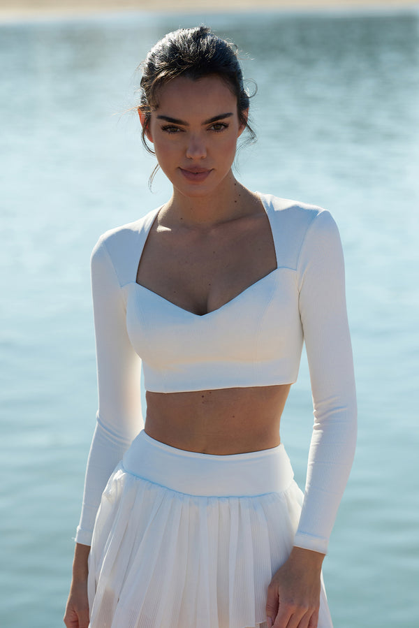 Model wears WISKII Elegant Long Sleeve Crop Top |  Ivory