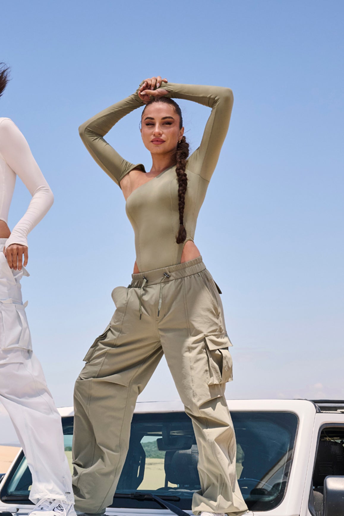 Model wears Unique Cut Long Sleeve Bodysuit | WISKII Active | Muted Khaki