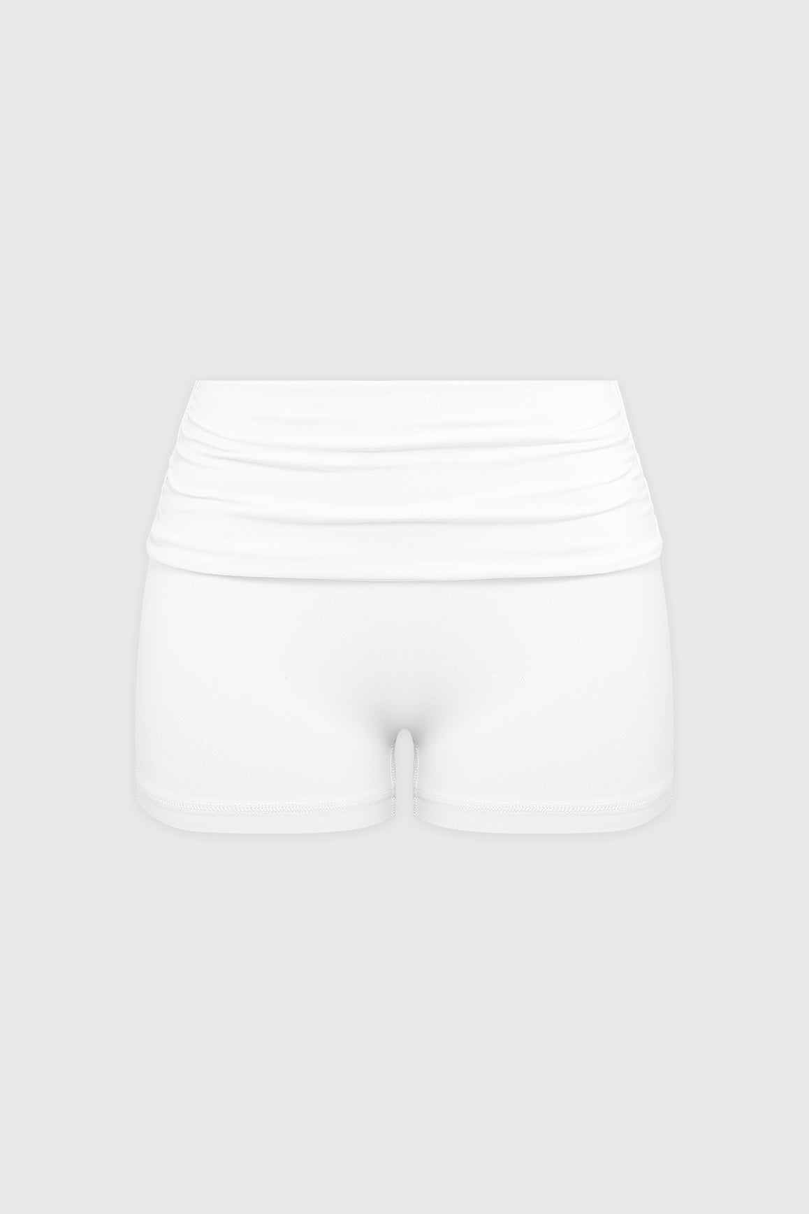 WISKII Riviera low-rise scrunch shorts in vibrant fabric, featuring a fitted design and stylish front detail.