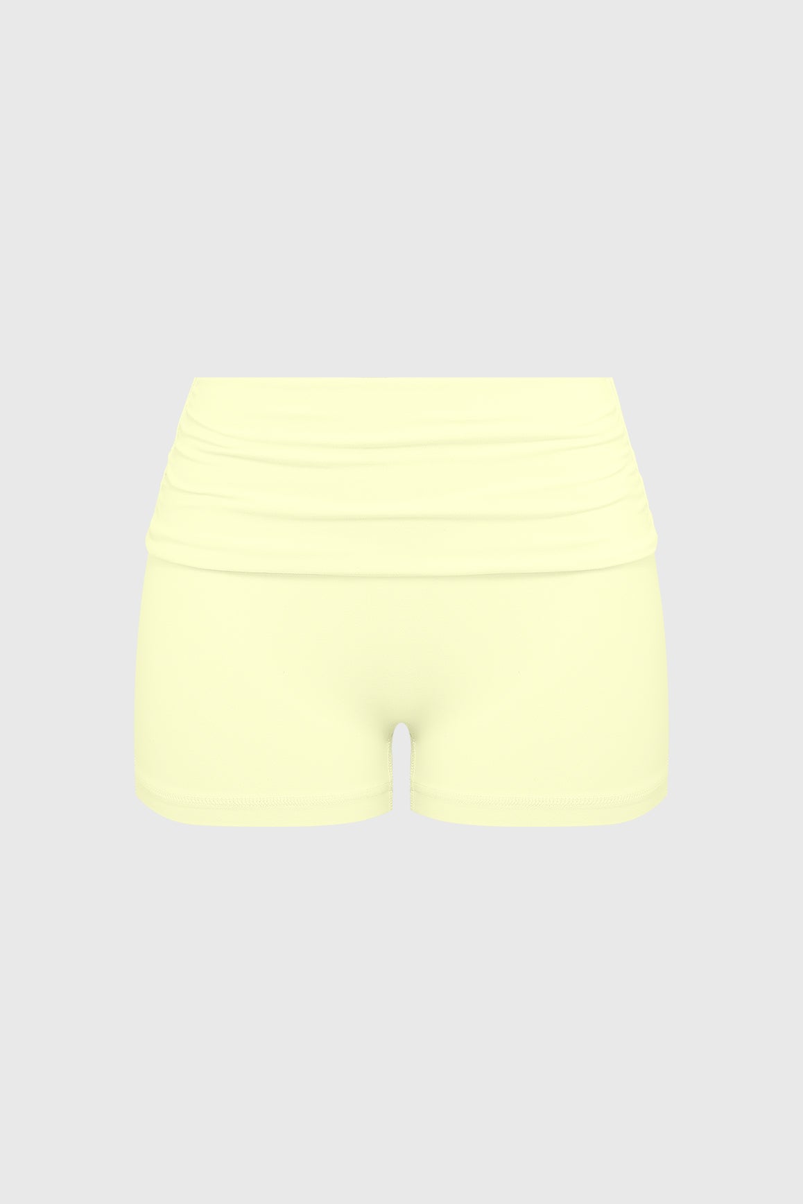 WISKII Riviera low rise scrunch shorts in vibrant fabric, featuring a relaxed fit and stylish design on a model.