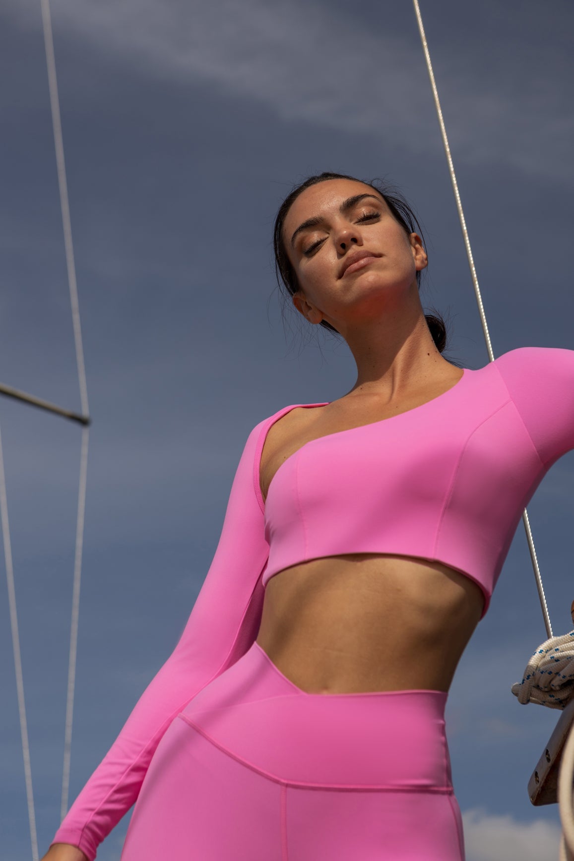 Model wears Unique Cut Long Sleeve Crop Top | WISKII ACTIVE