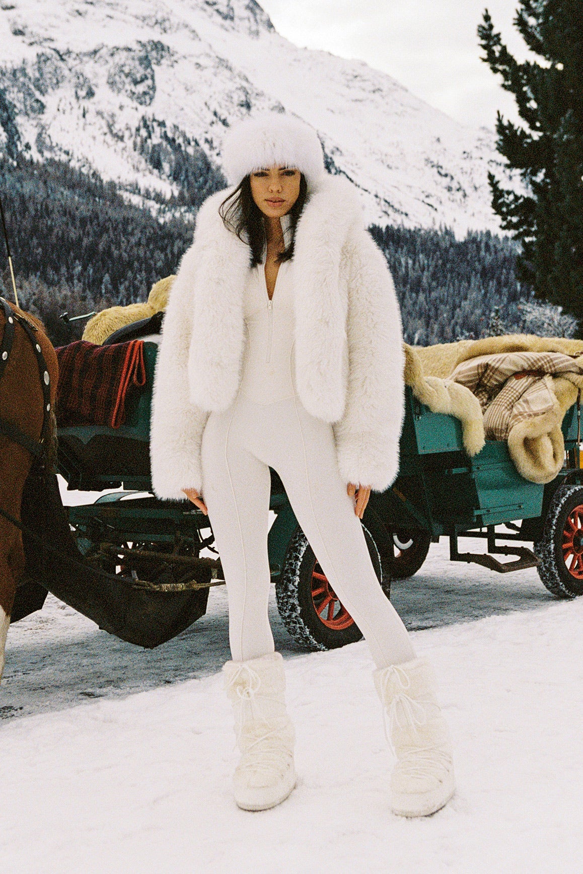 WISKII Alpine Cloud faux fur jacket featuring a cozy hood and plush fur texture, perfect for stylish cold-weather wear.