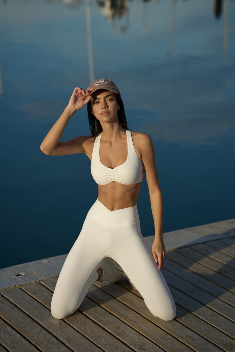 Model wears WISKII Ruched Sports Bra + V-waist Yoga Legging | WISKII 