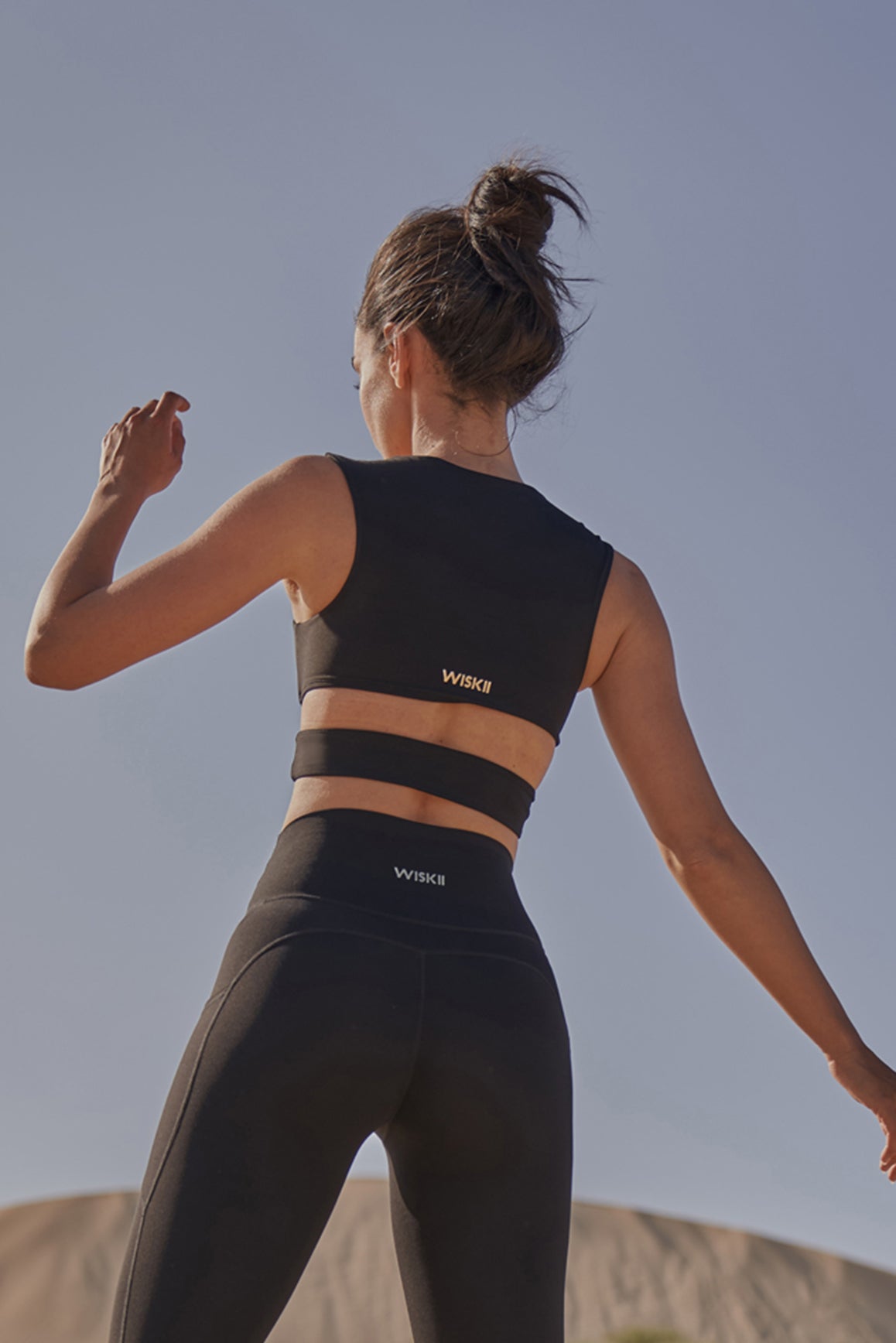 Model wears Elegant Corset Sports Bra | WISKII ACTIVE