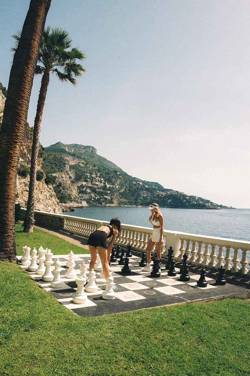 Model wears a High-Waist Scallop Split Front Skirt | Black | WISKII Active