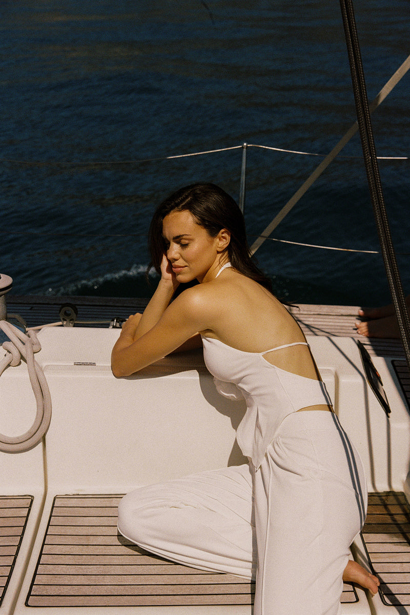 Model wears a Riviera Floral Halter Vest | Ivory | WISKII Active