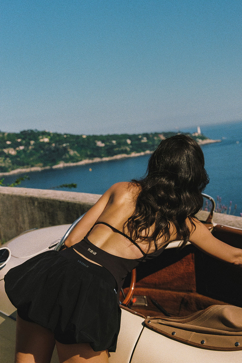 Model wears a Riviera Floral Halter Vest | Black | WISKII Active