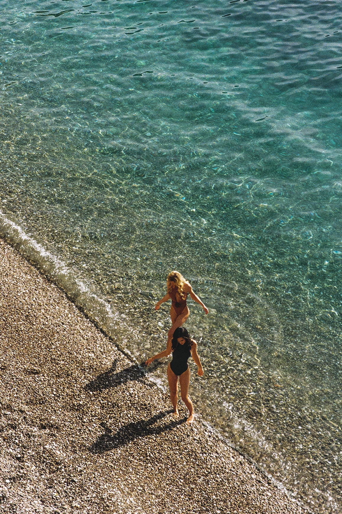 Model wears a Riviera Floral Backless One-piece Swimsuit | Deep sea Swimsuit | WISKII Active