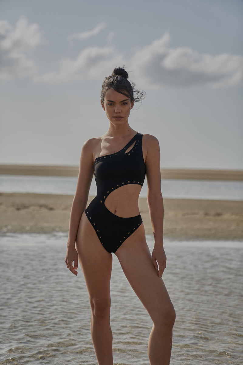 Model wears WISKII One Shoulder Laser Cut Swimsuit