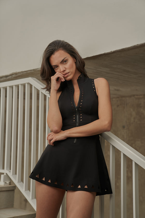 Model wears WISKII Lavish Laser Cut Zip Dress