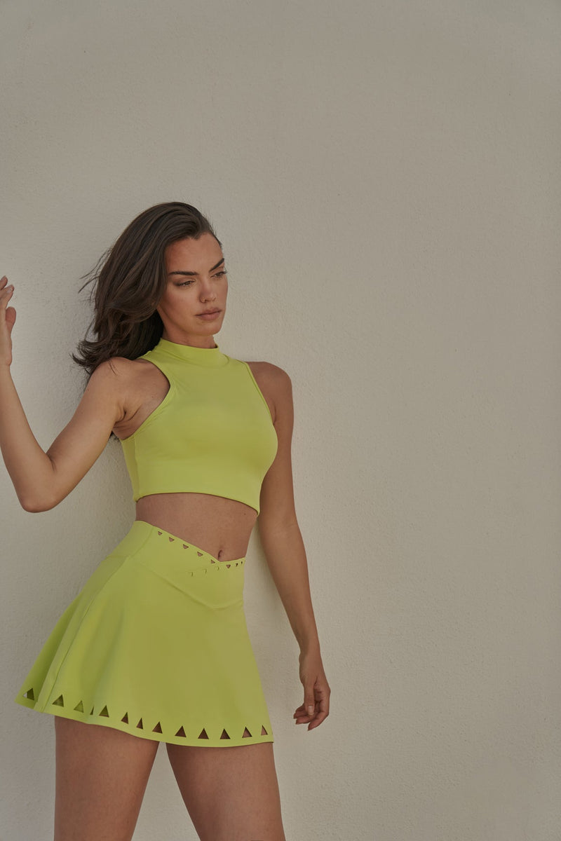 Model wears WISKII V-waist Laser Cut Tennis Skirt
