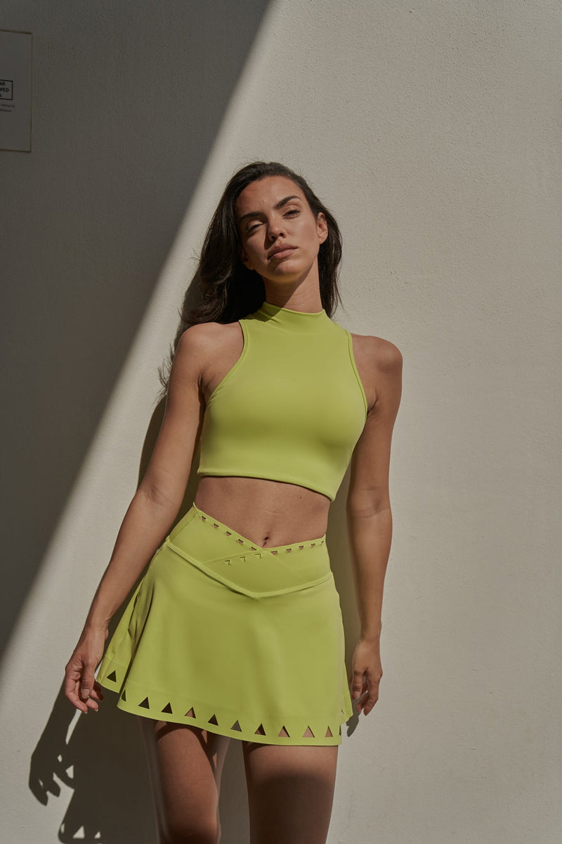 Model wears WISKII V-waist Laser Cut Tennis Skirt