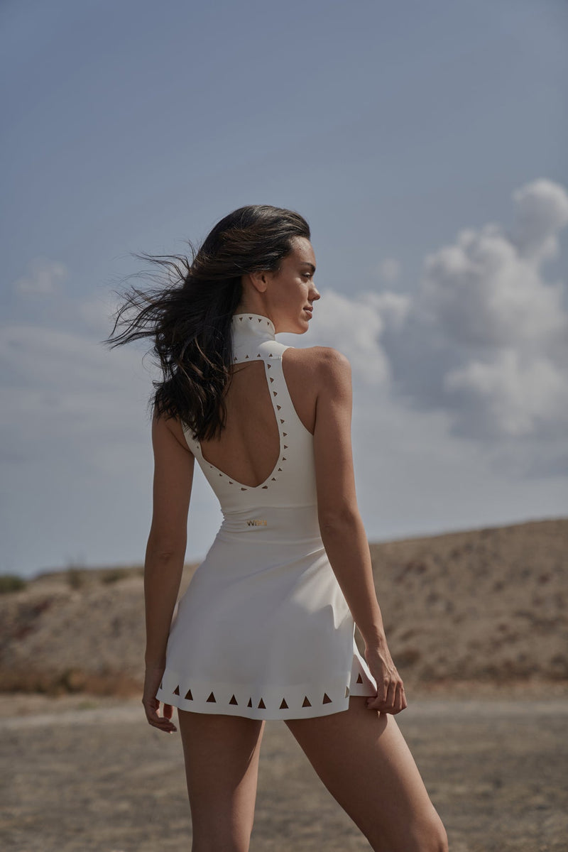 Model wears WISKII Lavish Laser Cut Zip Dress
