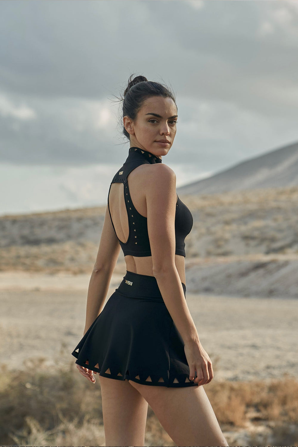 Chic High Neck Laser Cut Sports Bra & V-waist Tennis Skirt Set