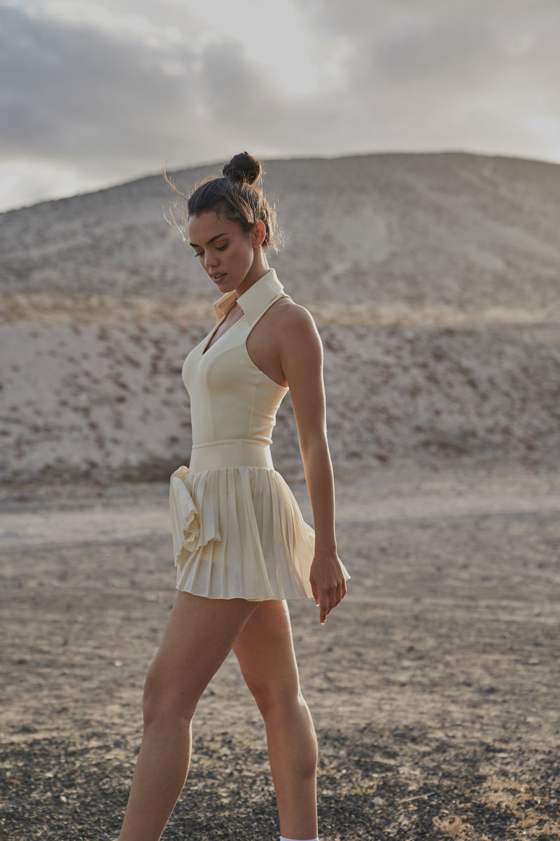 The WISKII Pure Vanilla Pleated Skirts were worn by a model.