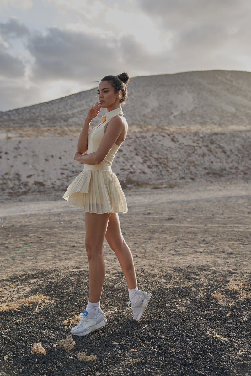 Model wears Sleeveless Polo Tank Top + WISKII Pleated Skirts | WISKII