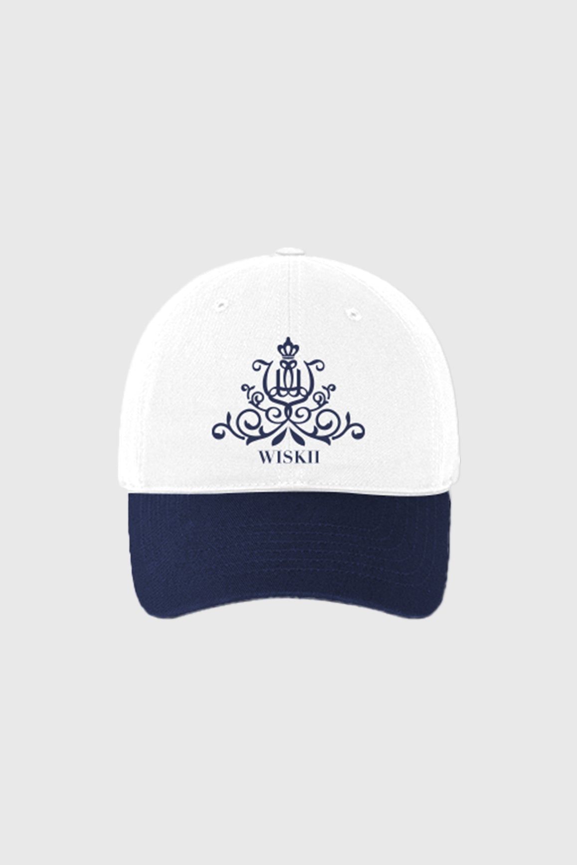 WISKII Studio Sport Cap in white and midnight colors, stylish accessories for active wear, with adjustable fit and breathable fabric.