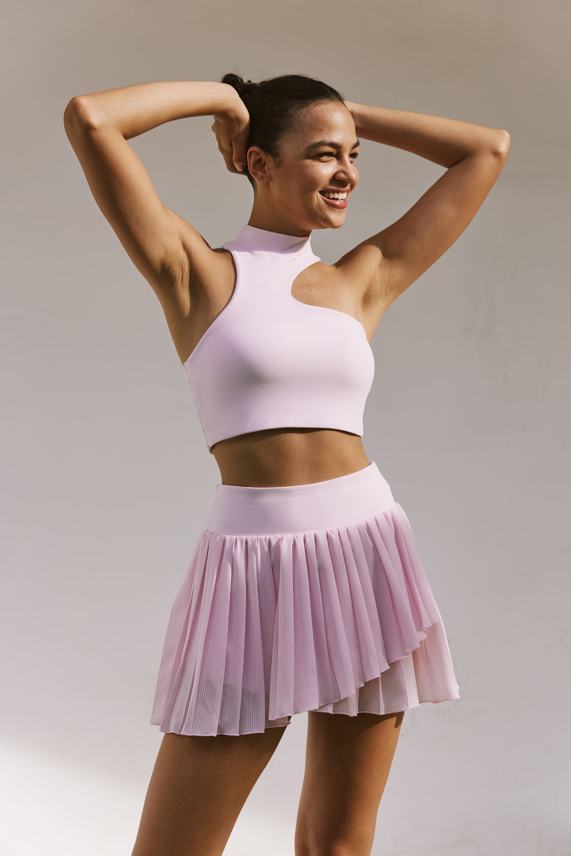 Model wears WISKII Pleated Skirts | WISKII ACTIVE