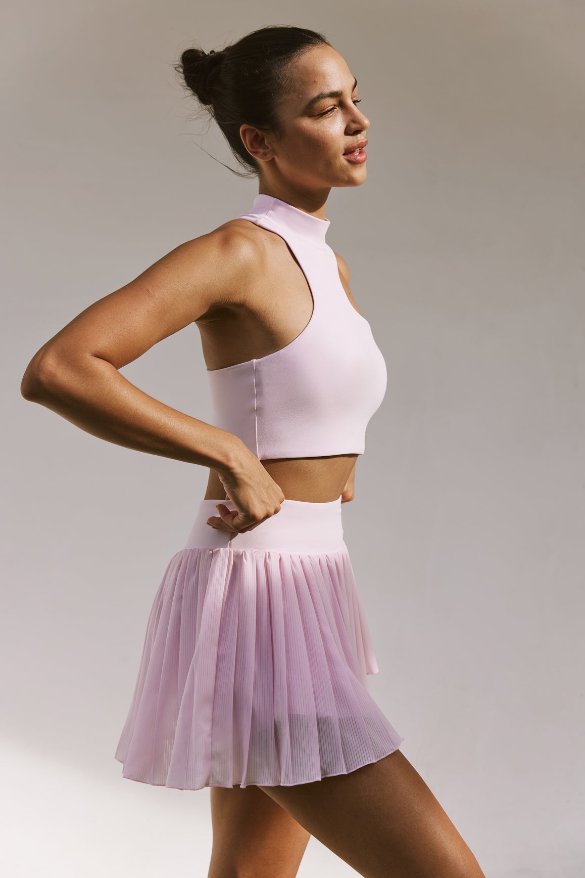 Model wears WISKII Pleated Skirts | WISKII ACTIVE