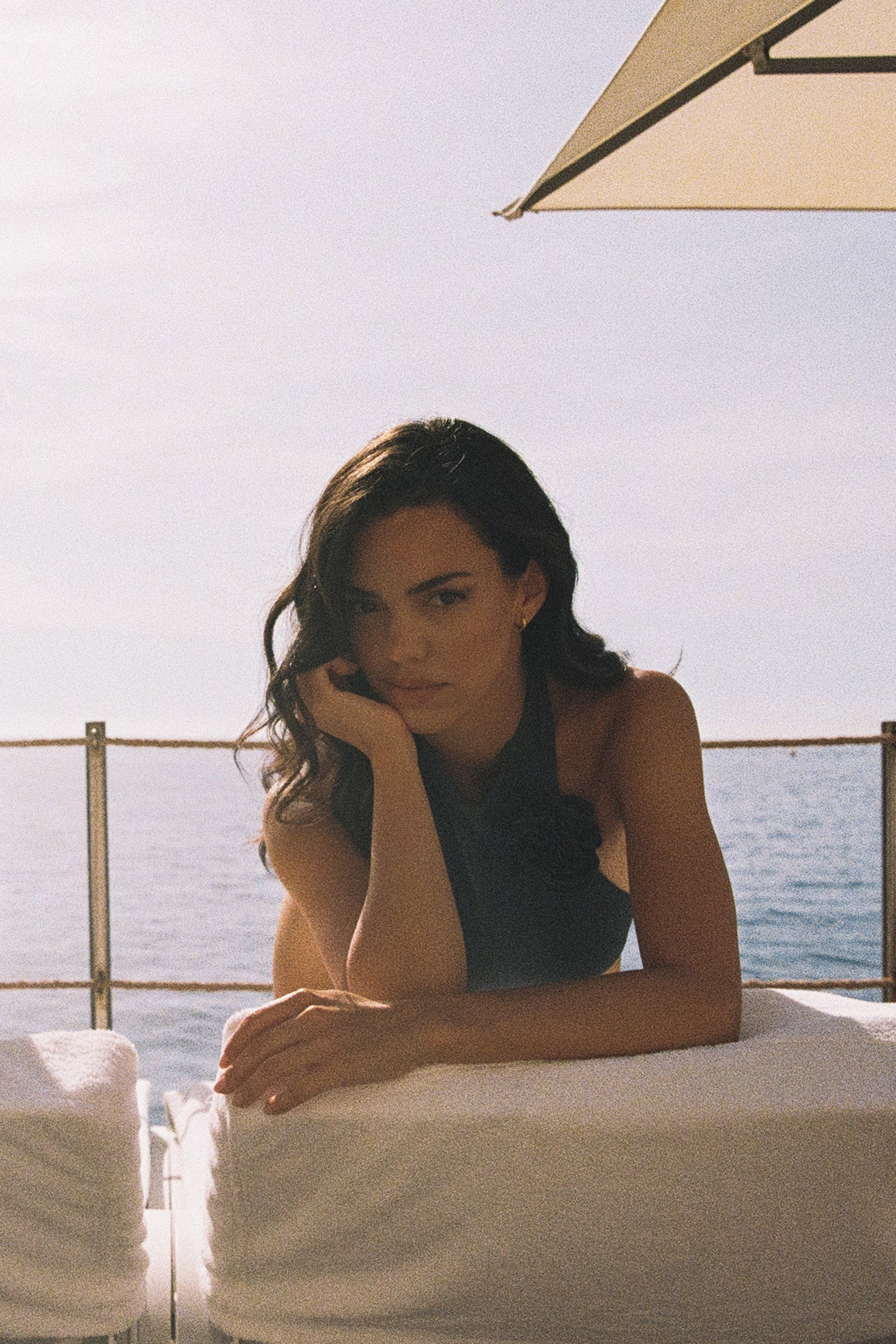 Model wears a Riviera Floral Backless One-piece Swimsuit | Deep sea Swimsuit | WISKII Active