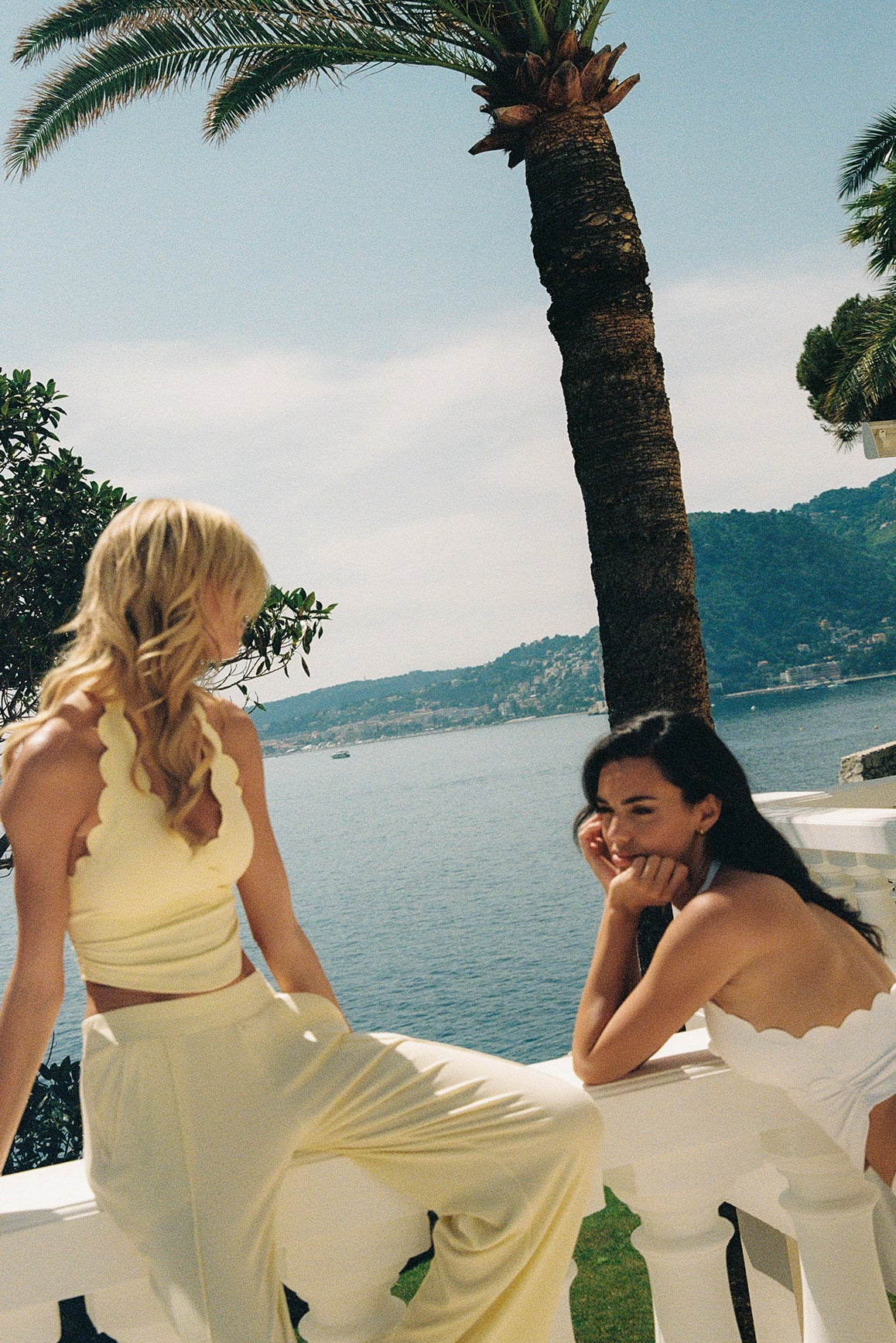 Models wear Riviera Scallop Halter Bra Tank | WISKII Active