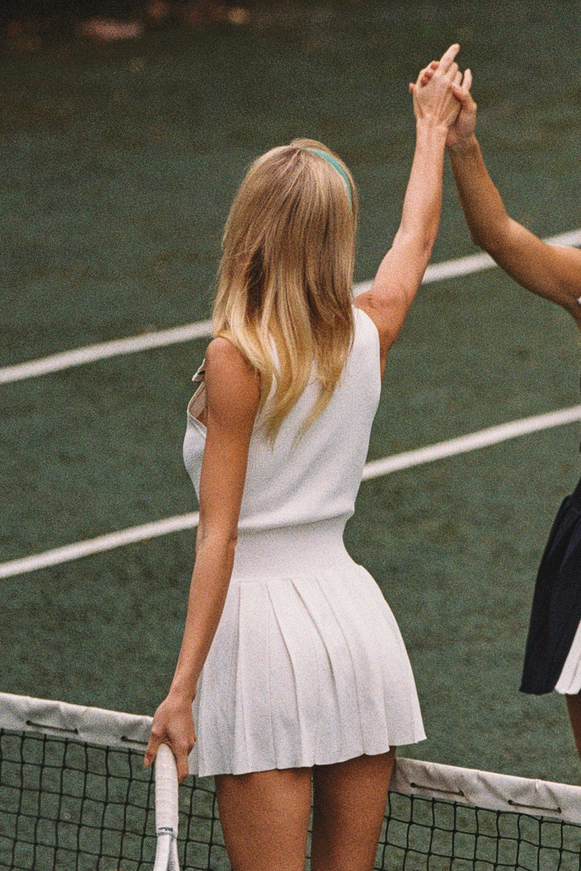 WISKII sleeveless full-zip dress featuring a sleek design and modern style, showcased on a model in a fashion photoshoot.