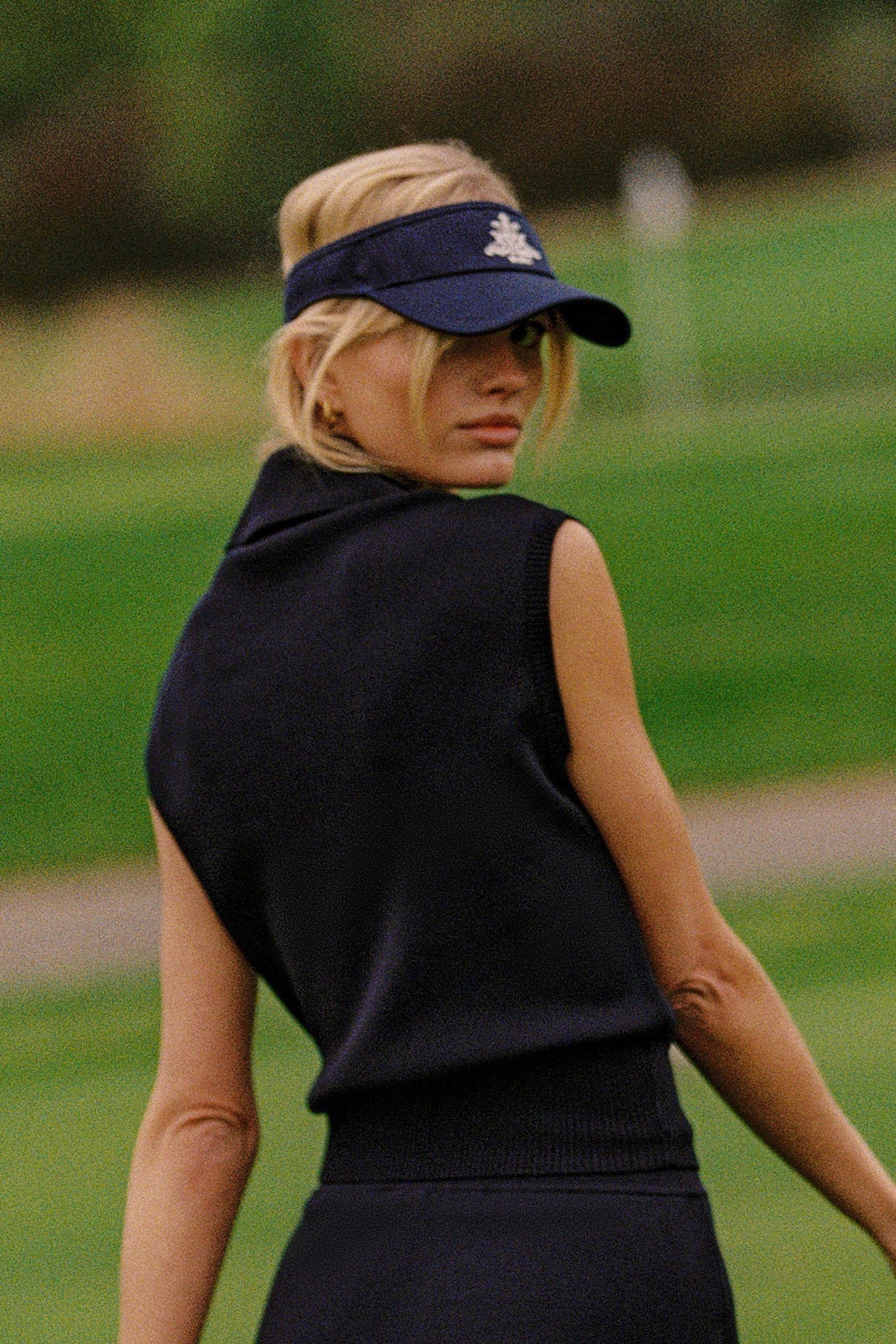 WISKII Cap-Sleeve Knit Polo tank top in soft fabric, featuring a classic collar and button front, perfect for casual wear.