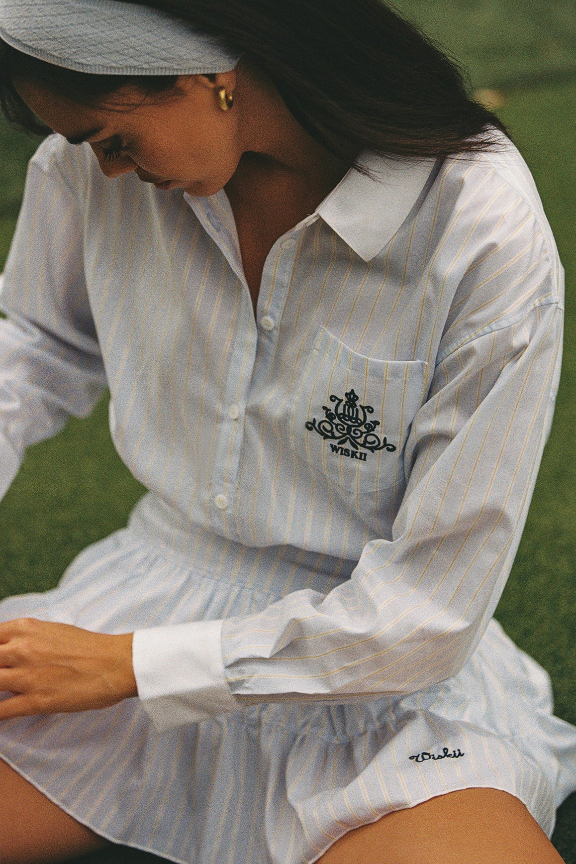 WISKII Stripe Button-Down Crop Shirt displayed on a hanger, featuring classic collar, long sleeves, and a fitted style.