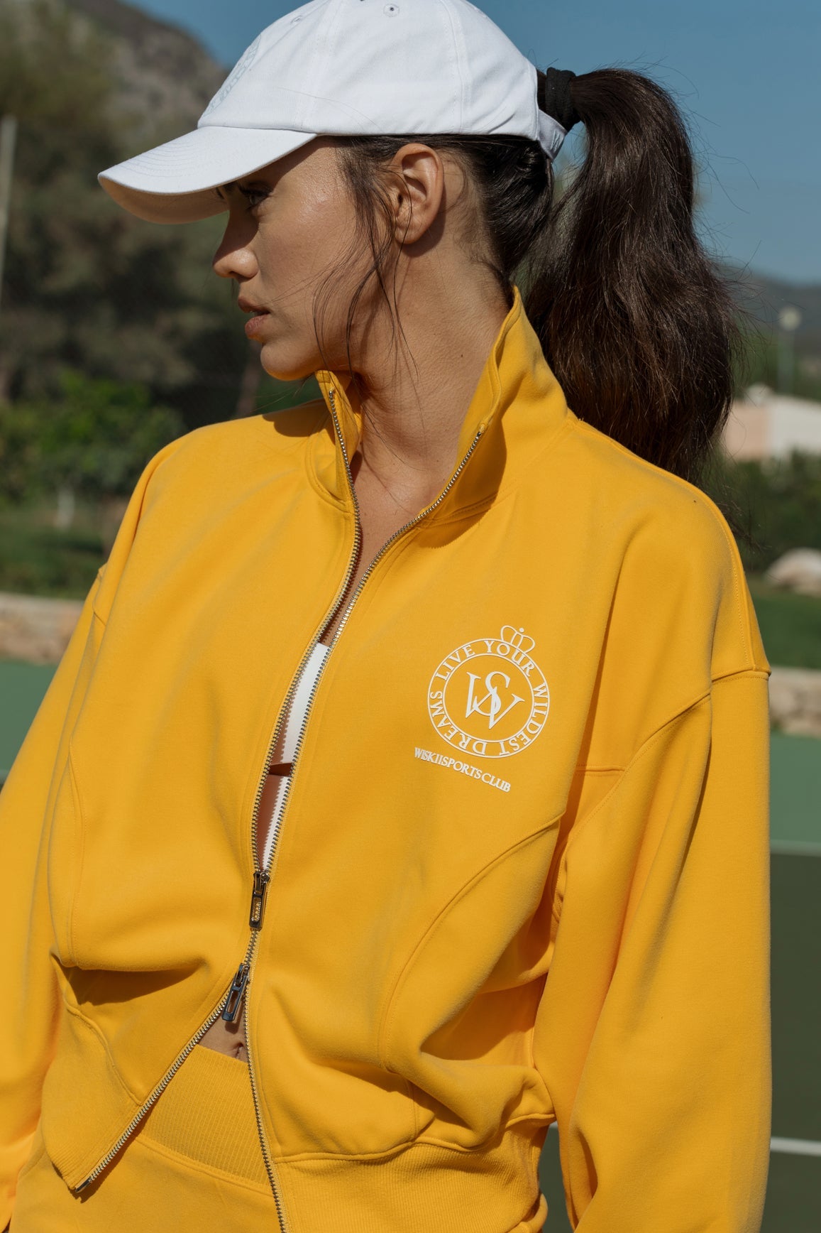 WISKII two-way zipper jacket and stylish mini sweat skirt in flame orange, size S, on a model.