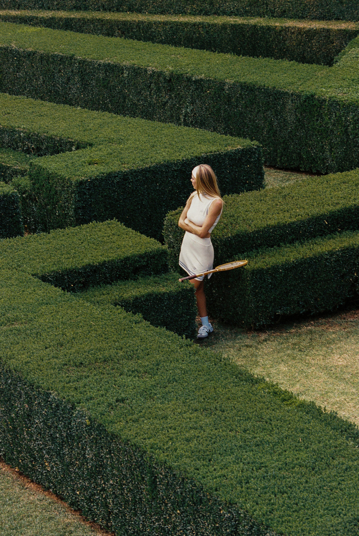 Cream WISKII Mirto Knit Mock Neck Tank crop top with fitted design and ribbed texture, ideal for casual or layered looks.
