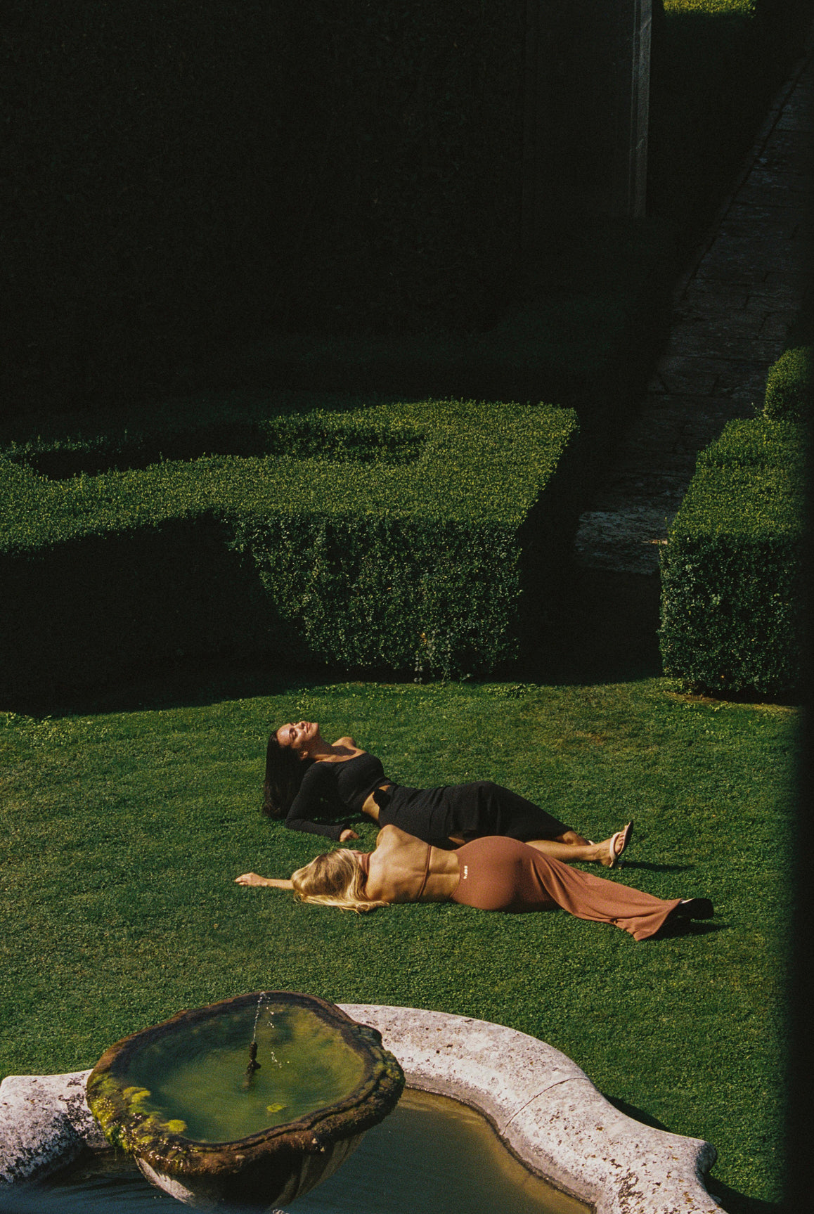 WISKII high neck open back floral dress in cinnamon with vibrant floral patterns and a flowing silhouette.