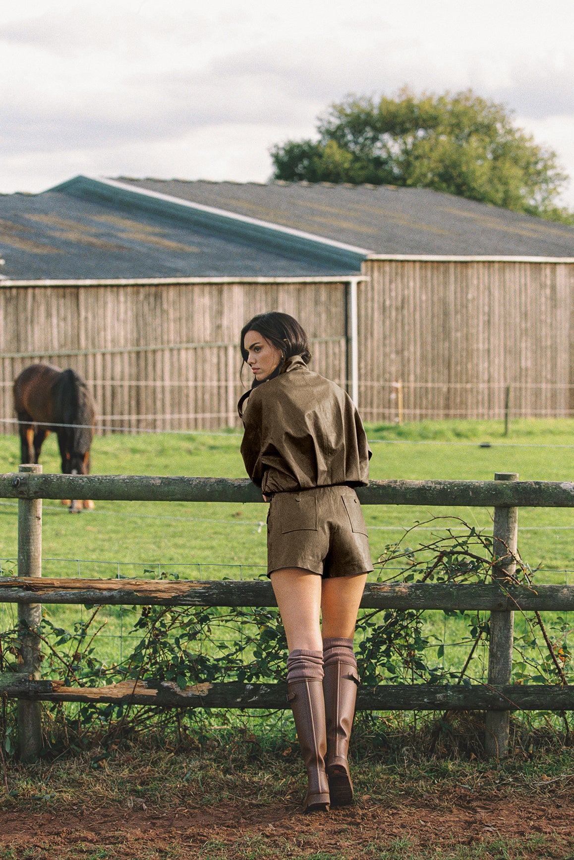 WISKII retro faux leather jacket in black with a hood, featuring a stylish design and zippered front.