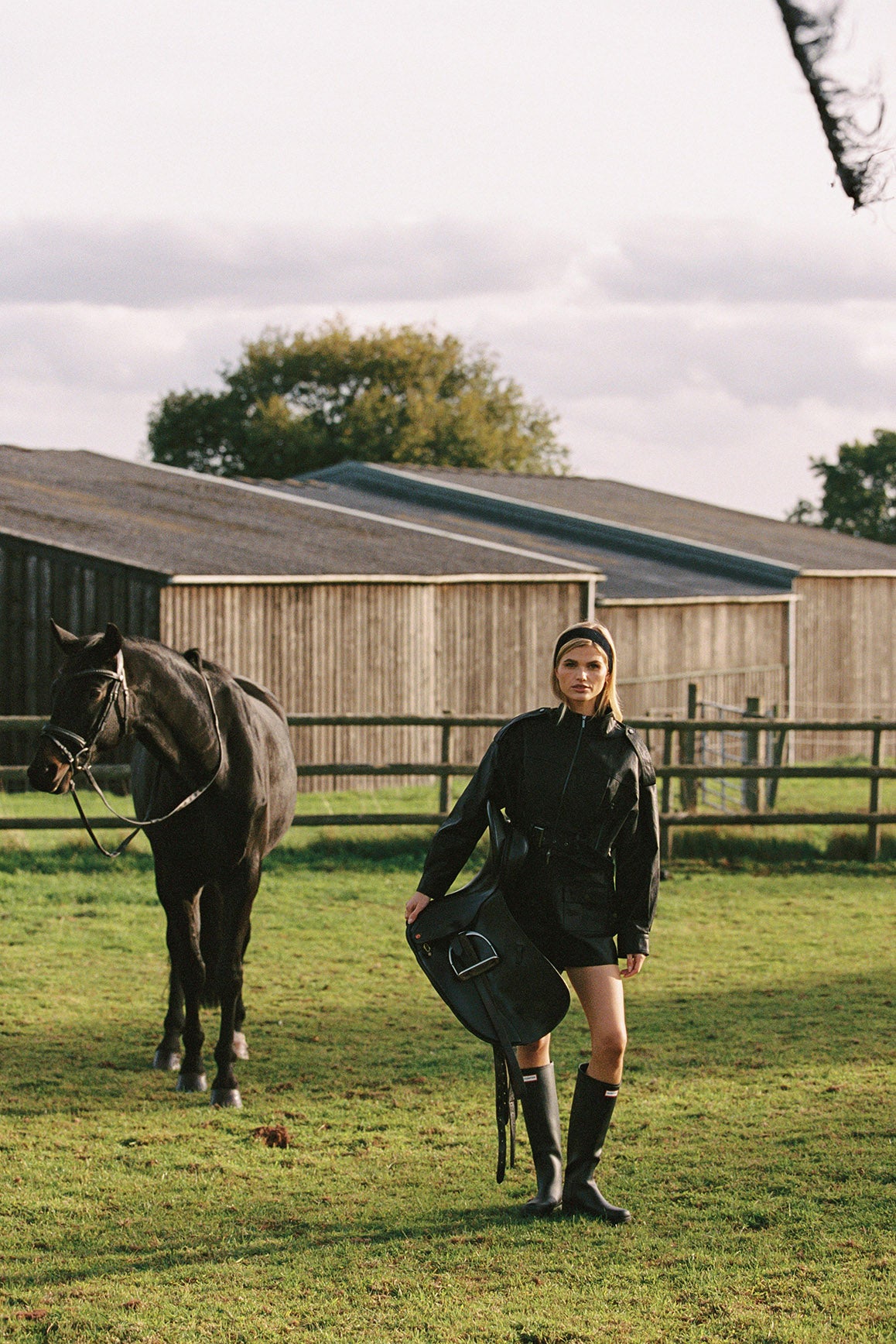 Retro faux leather jacket by WISKII with a stylish hood, featuring a classic design and textured finish.