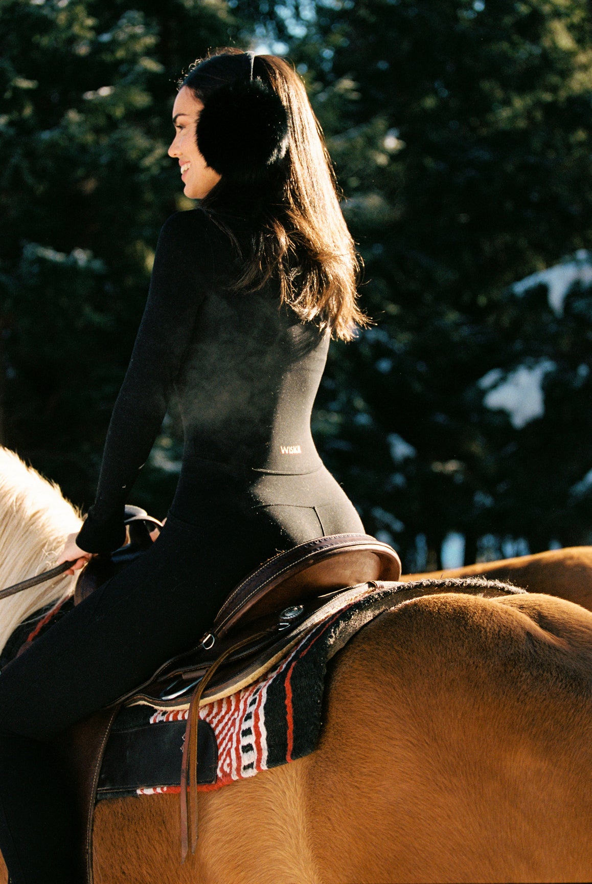 WISKII long sleeve half-zip full length unitard in black, featuring a sleek, fitted design perfect for active wear.