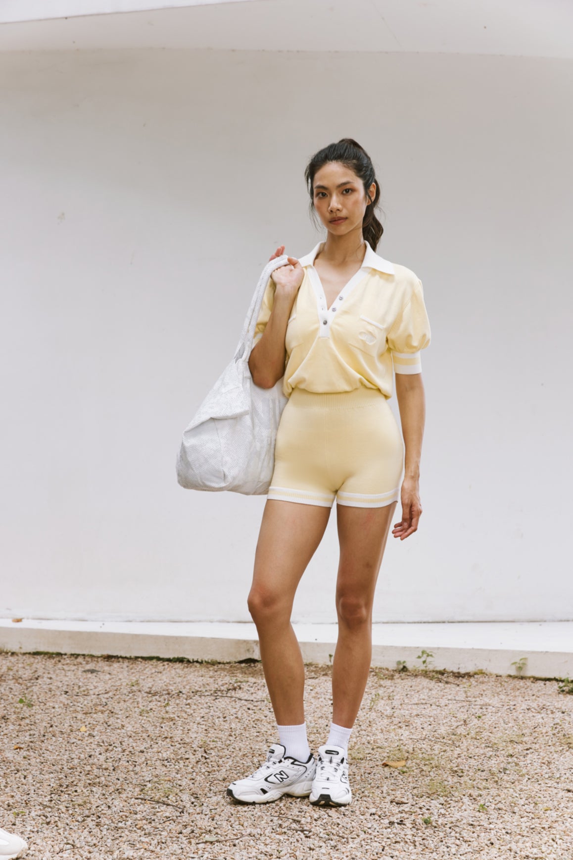WISKII lemon chiffon V-neck polo short sleeve playsuit, casual jumpsuit with relaxed fit and lightweight fabric.