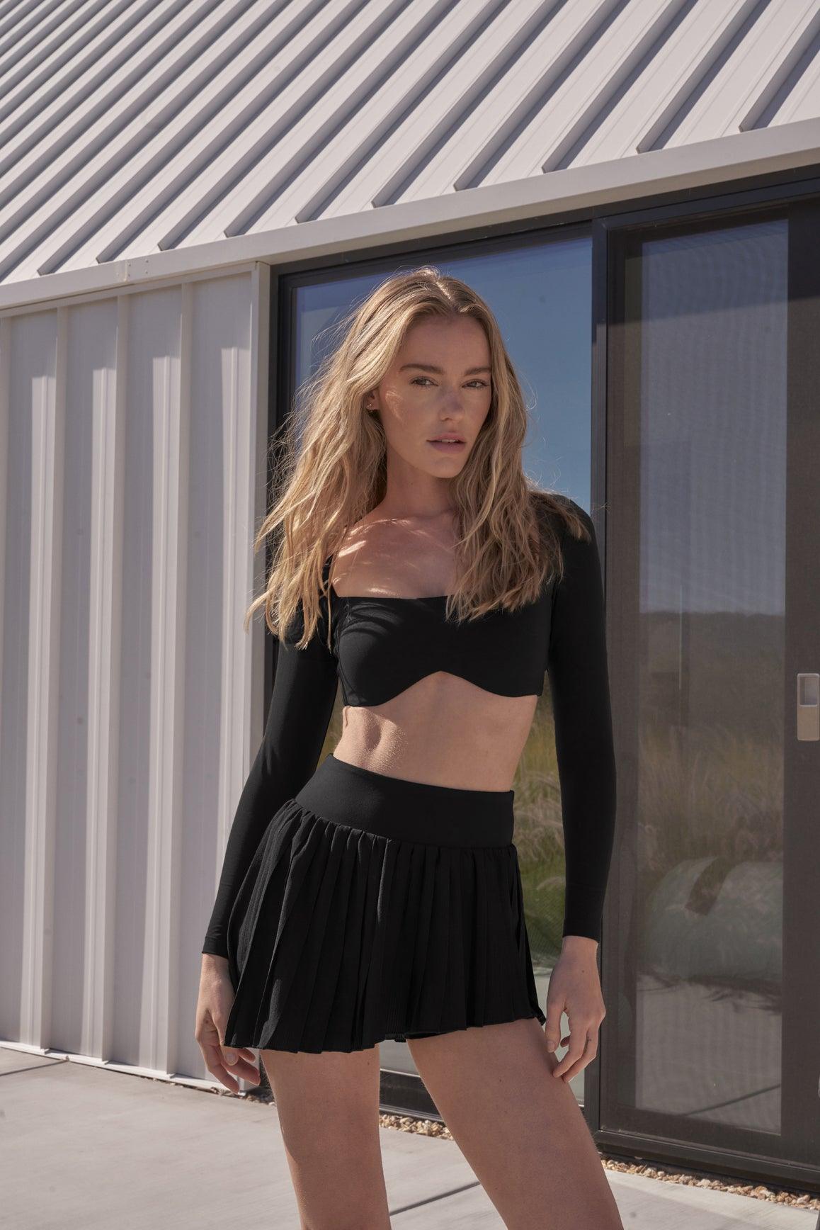 Ivory WISKII Lite Pleated Skirt, flowy and stylish, with soft pleats and lightweight fabric perfect for casual and dressy occasions.
