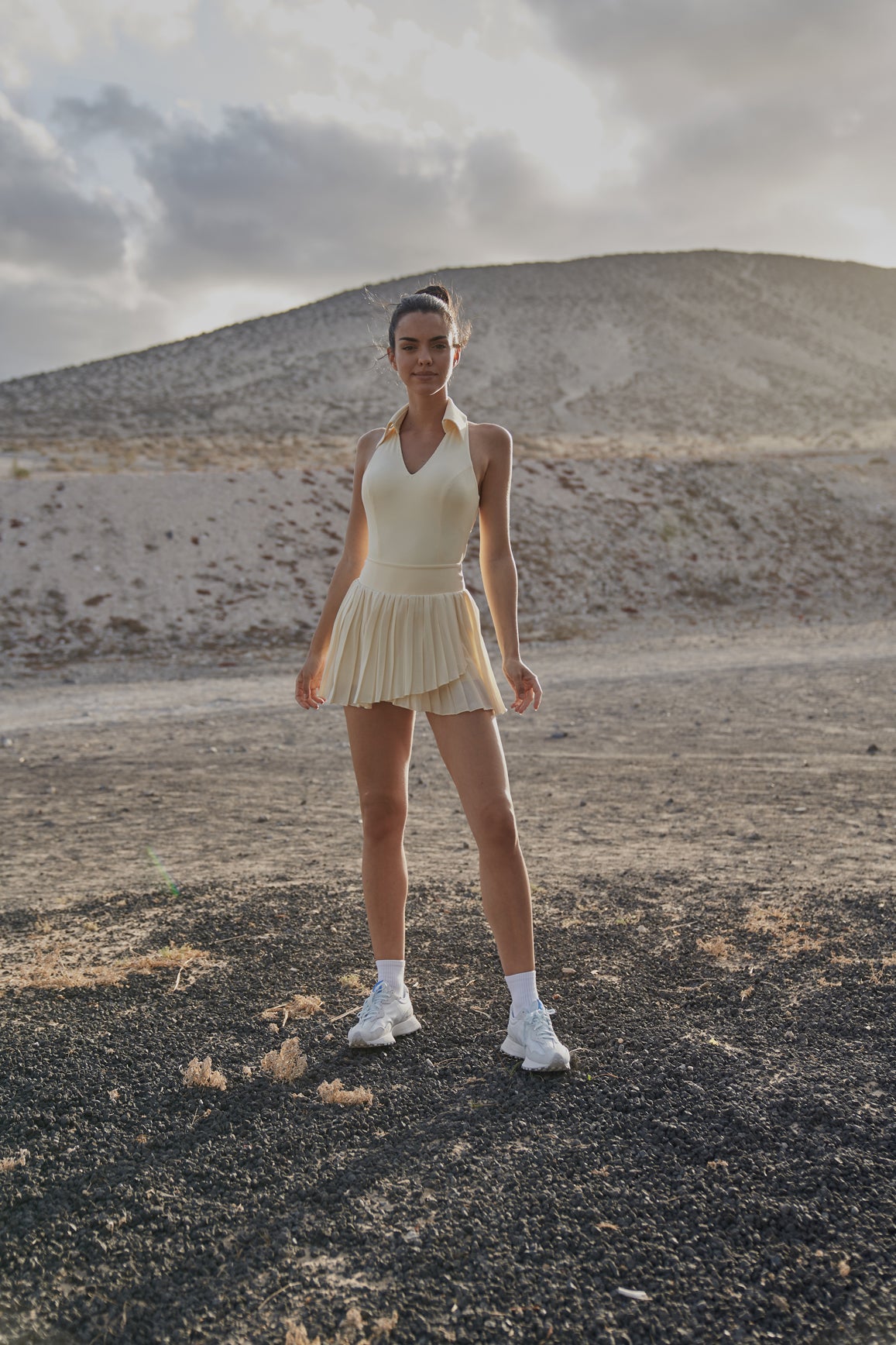 Model wears WISKII Pleated Skirt