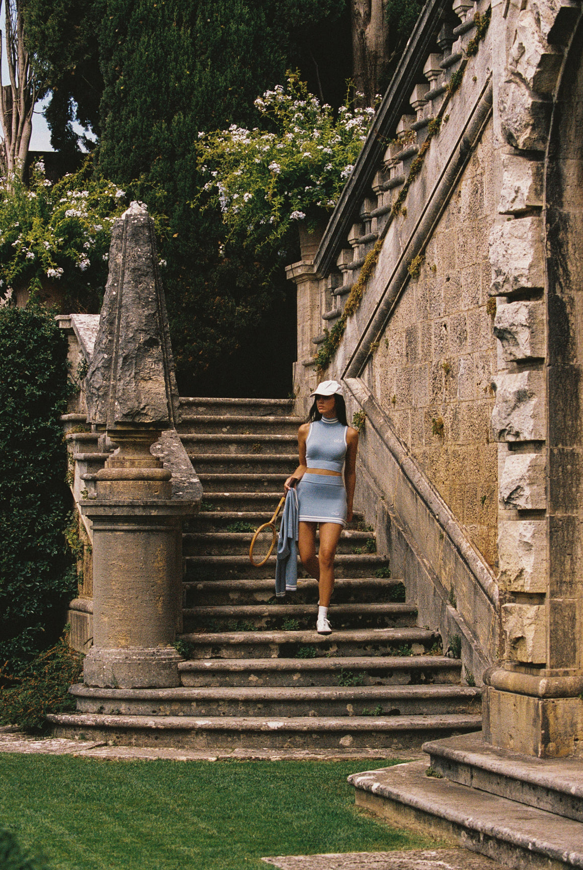 WISKII Mirto Knit Mini Skirt in Liberty Blue, showing a fitted mini skirt with ribbed knit texture and high waist design.