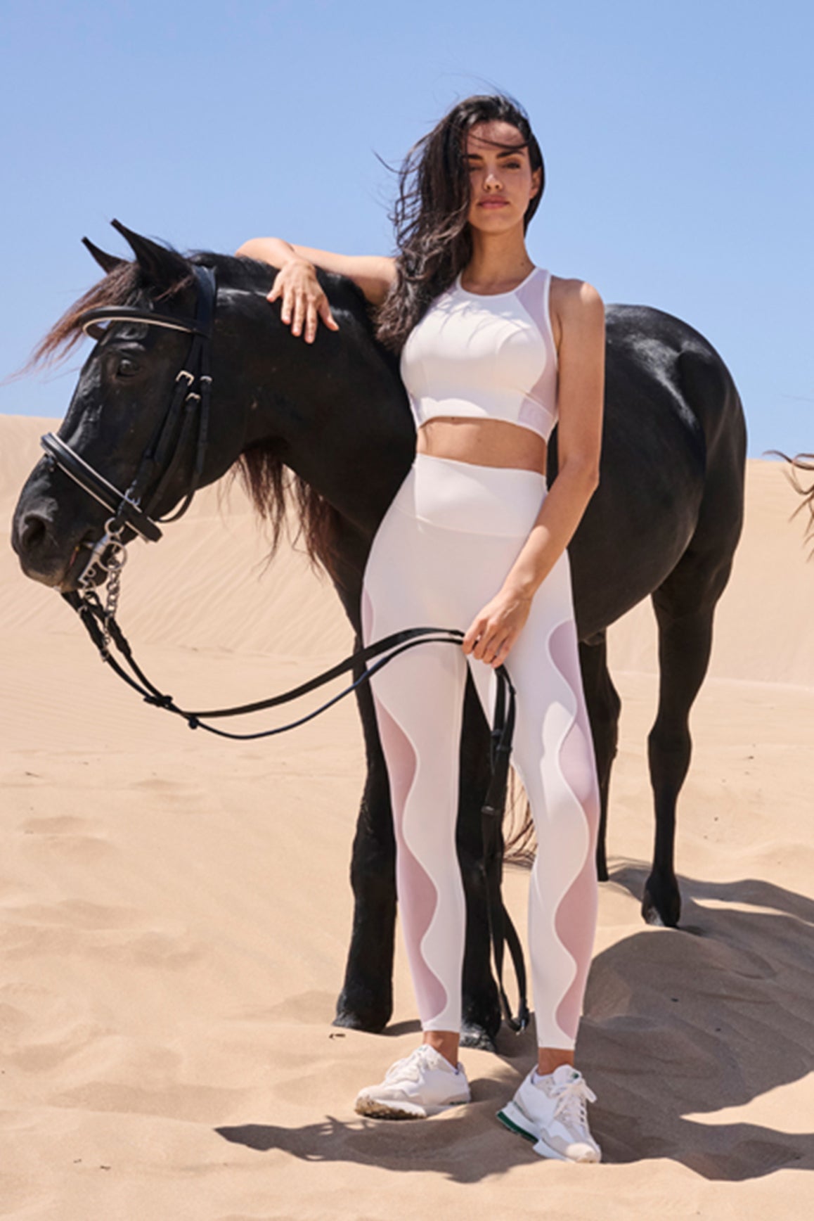 Ivory WISKII Mesh Racerback Sports Bra showing breathable mesh fabric and supportive design for active wear.