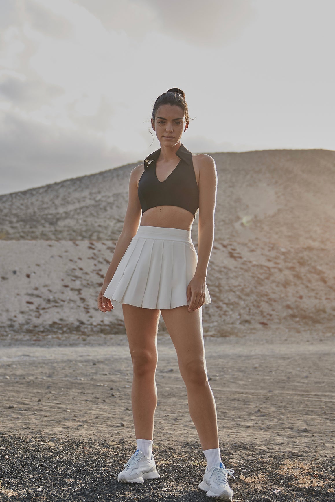 WISKII sleeveless polo sports bra in ivory, featuring a comfortable fit and sleek design for active wear.