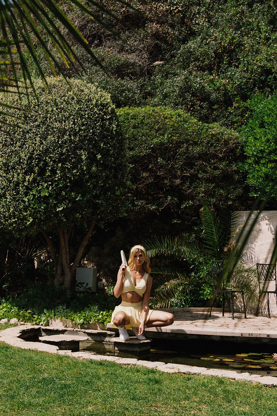 Model wears a Riviera Floral Ruched Bra | WISKII Active | Lemon Drop