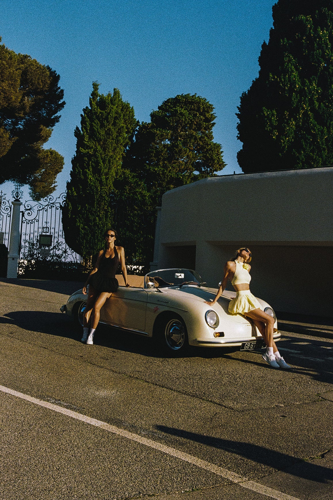 WISKII Riviera floral halter mock neck top paired with a mini bubble skirt, showcasing a vibrant floral pattern.