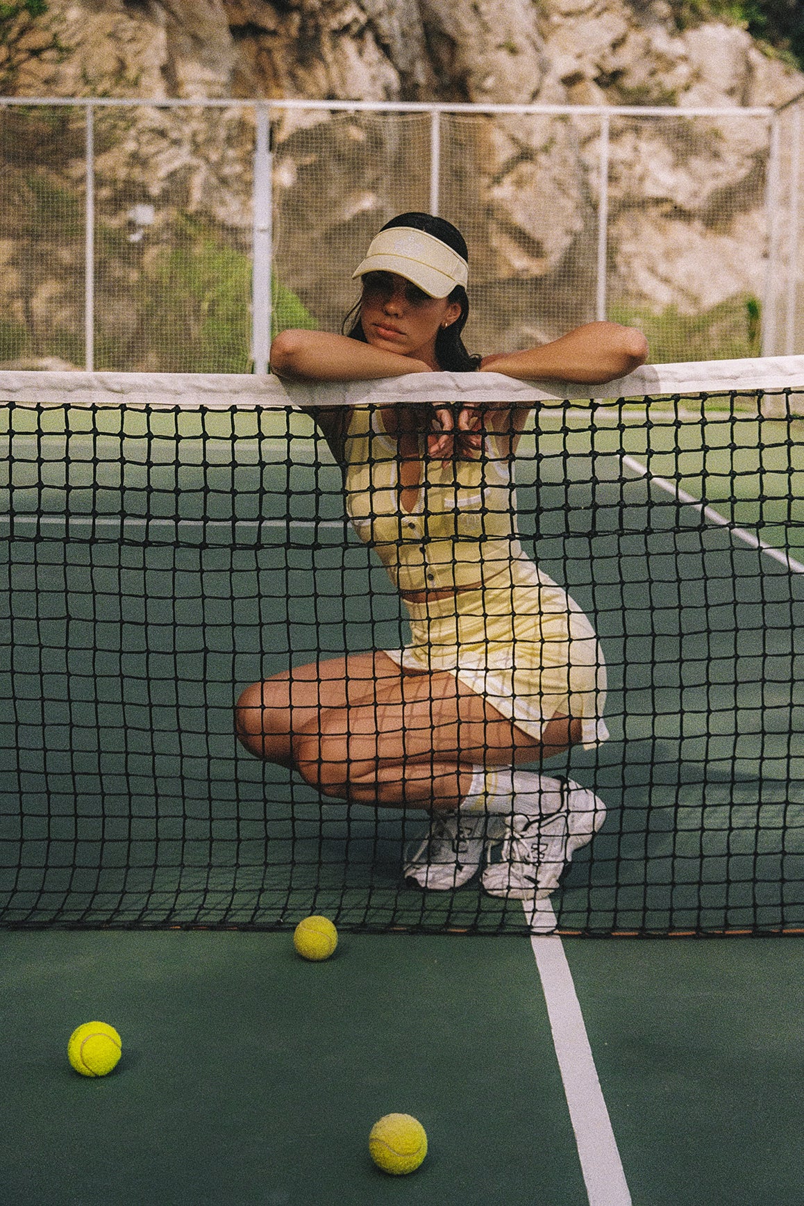 WISKII Mirto Knit Button Tank Top in lemon chiffon, featuring a sleeveless design and button details for a stylish look.