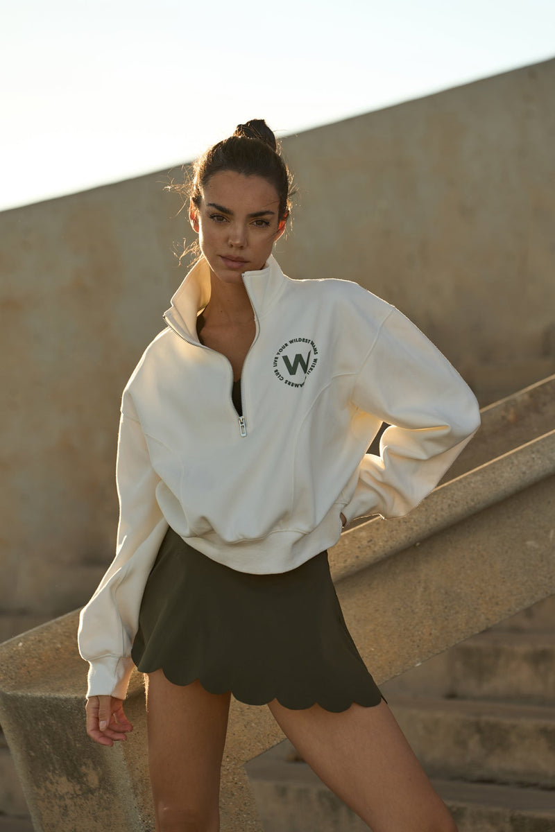 Model wears WISKII high waist a line tennis skirt