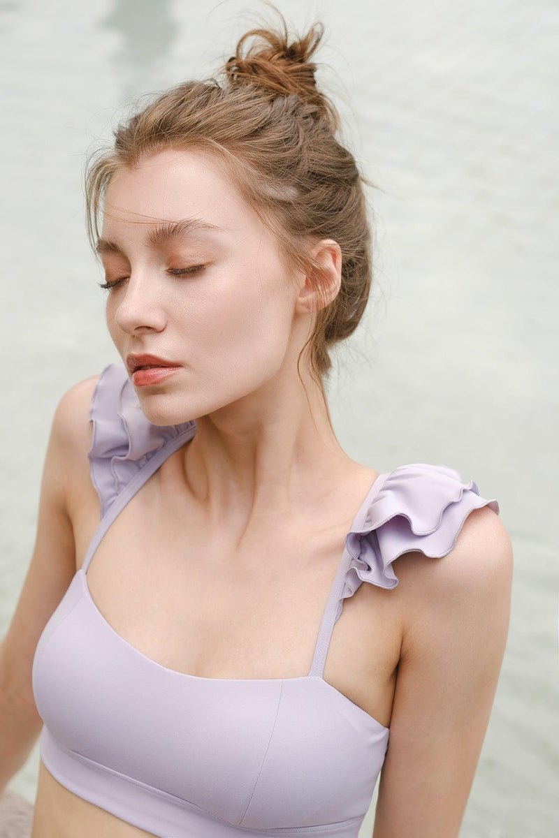 model wears a WISKII Lilac angel sports bra