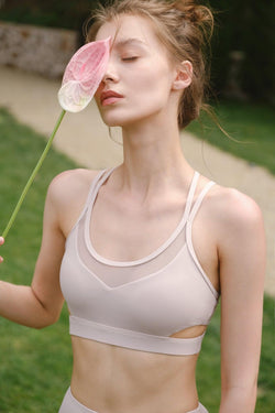 model wears a WISKII flex strappy sports bra