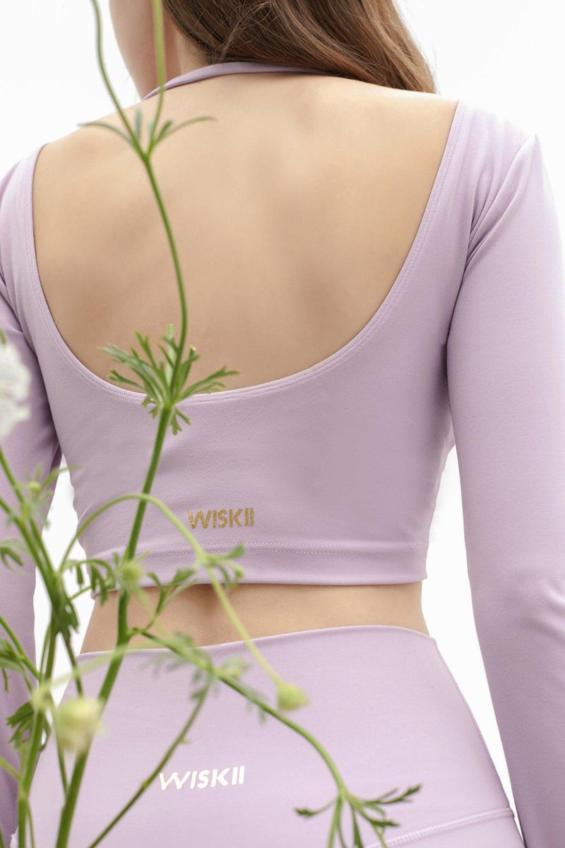 model wears a Meli Crop Top Romantic Purple From Wiskii Ative
