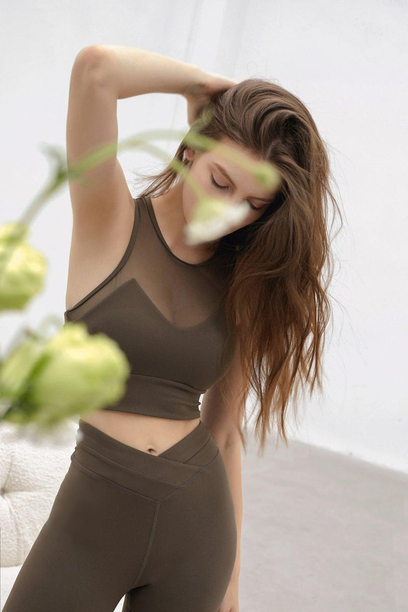 model wears a mesh tank top
